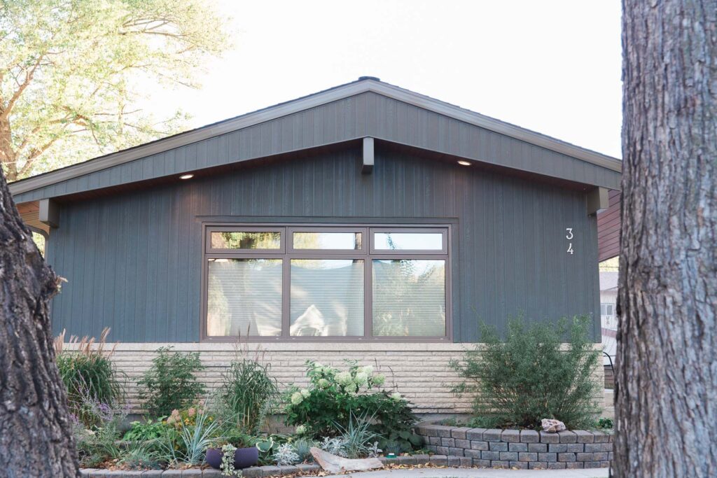 Winnipeg bungalow with vertical engineered wood siding