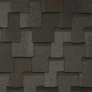 Close-up of grey architectural shingles with contrasting layered tabs