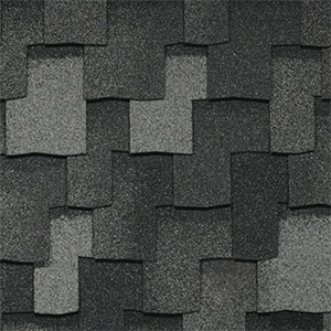 Close-up of grey architectural shingles with contrasting layered tabs