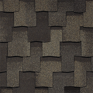 Close-up of dark brown architectural shingles with a layered pattern