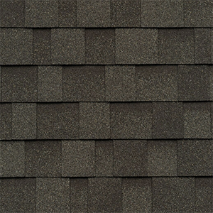 Close-up of grey architectural shingles with contrasting layered tabs