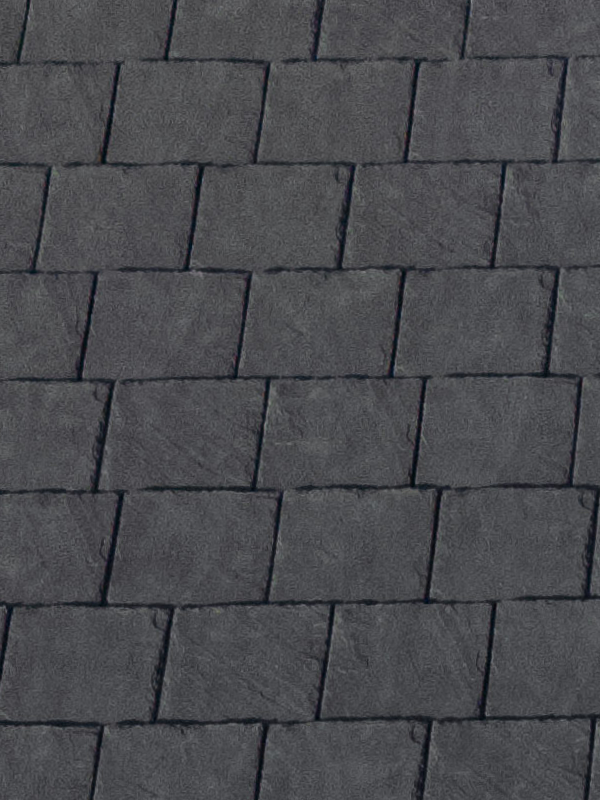 Close-up of grey synthetic composite slate roofing tiles with textured stone appearance.
