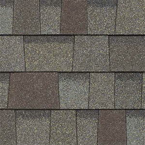 Close-up of grey and brown asphalt shingles with subtle colour variation