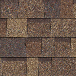 Close-up of light brown architectural shingles with contrasting layered tabs