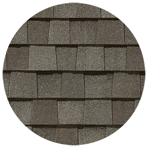 Close-up of grey architectural shingles in a staggered pattern