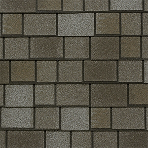 Close-up of grey architectural shingles with contrasting layered tabs