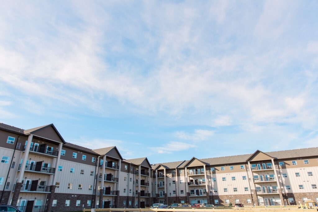 The back of the 4 storey level Ivy Trails Apartments, showing it's brown and beige stripes.